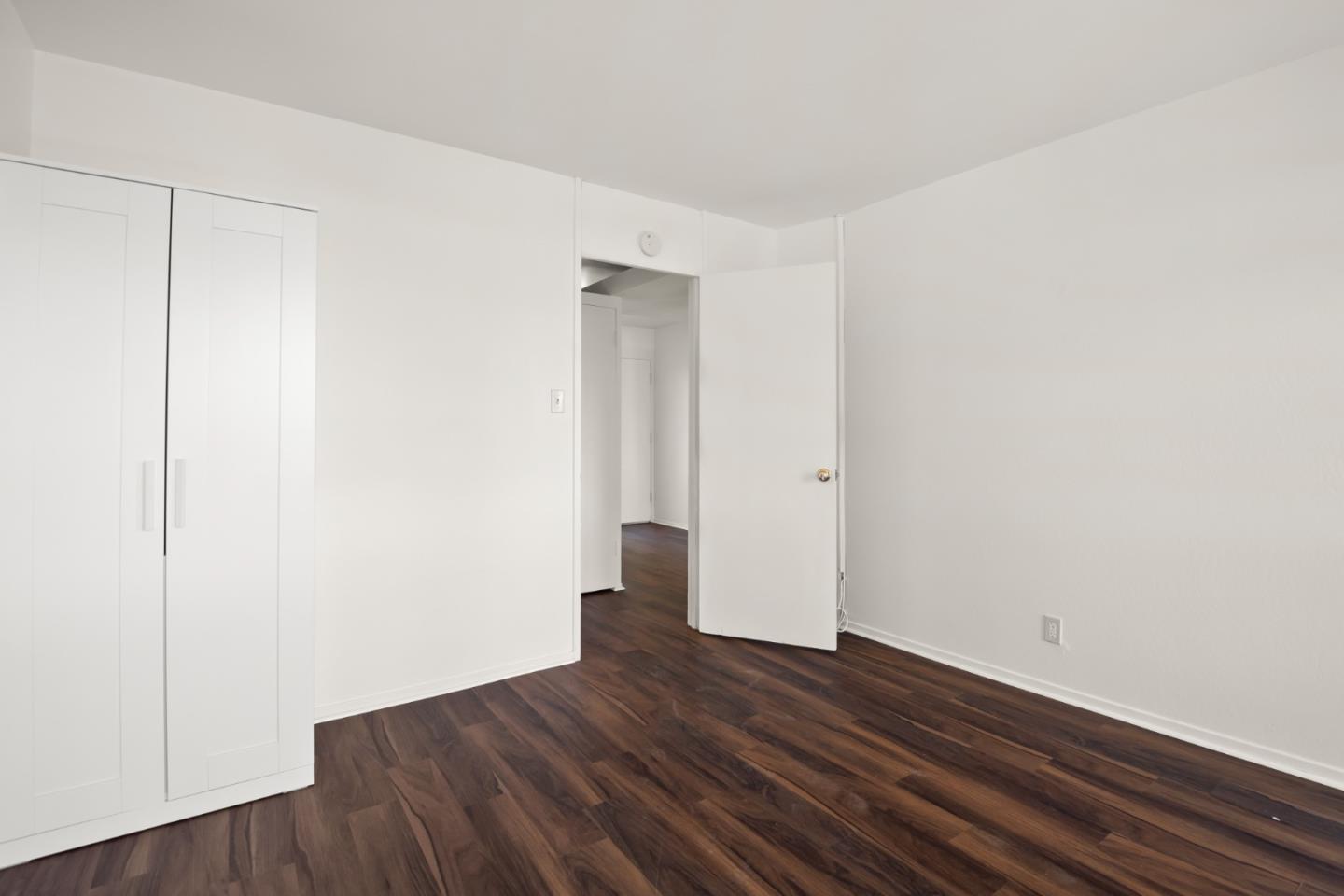 1775 Marco Polo Way Burlingame, CA 94010 - Photo 19 of 23 a view of an empty room with wooden floor