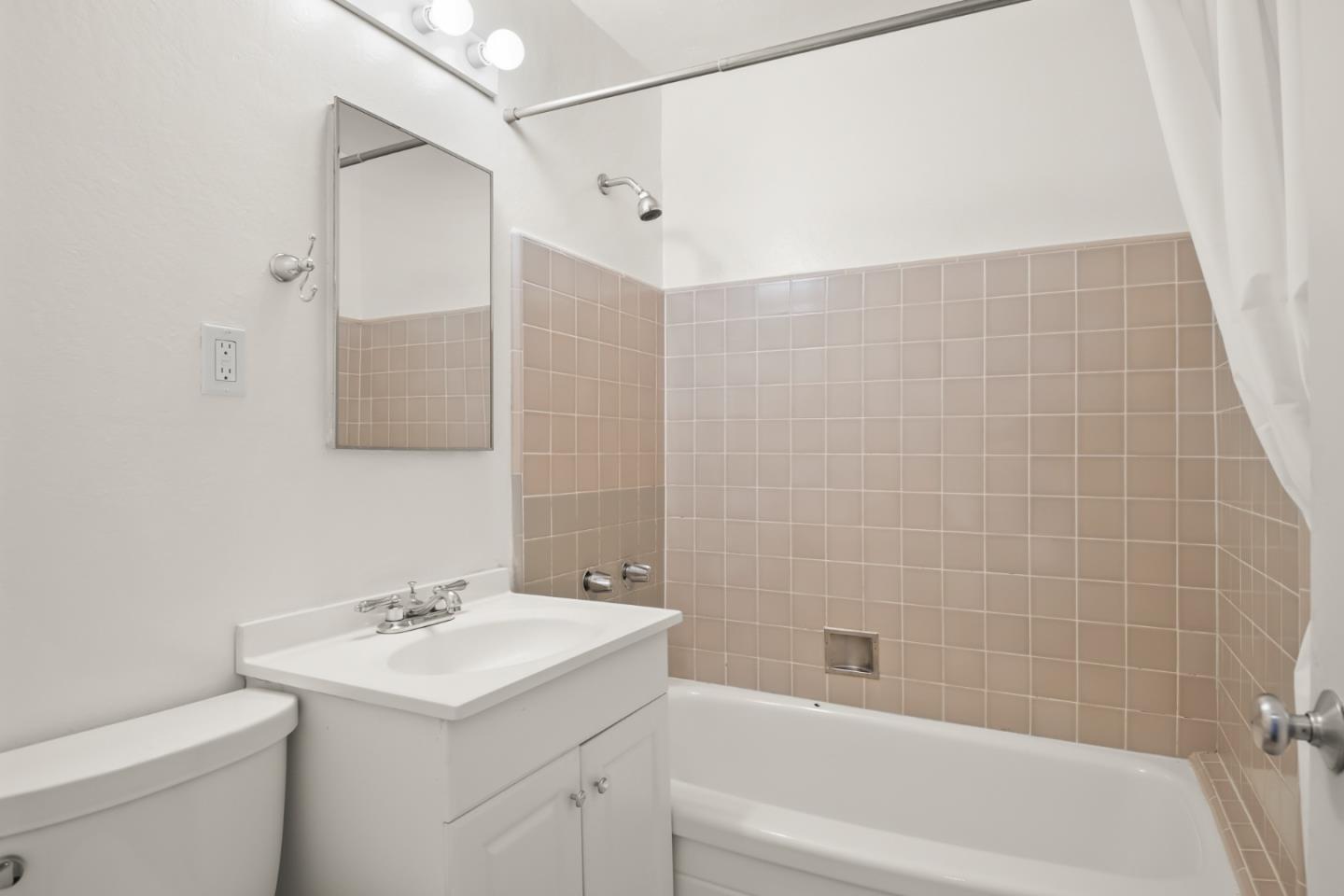 1775 Marco Polo Way Burlingame, CA 94010 - Photo 20 of 23 a bathroom with a sink toilet and shower