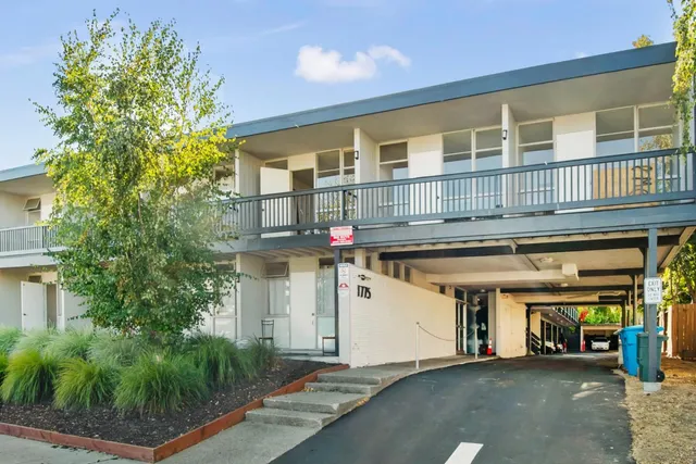 a front view of building with yard