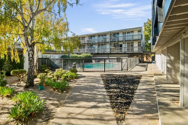 a view of a building with a yard