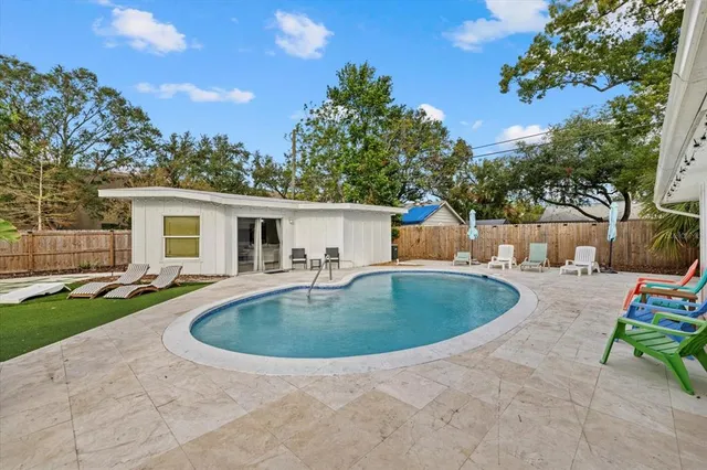 a living room with fireplace furniture and a flat screen tv