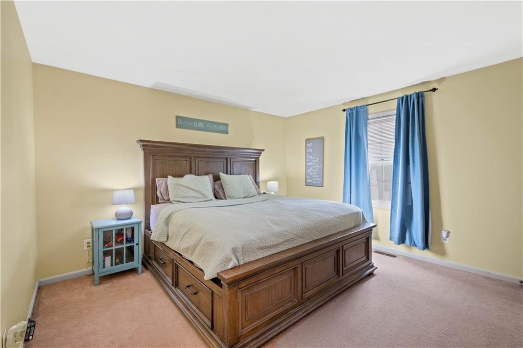 307 Lawrence Place Coraopolis, PA 15108 - Photo 16 of 25 a bed sitting in a bedroom next to a window