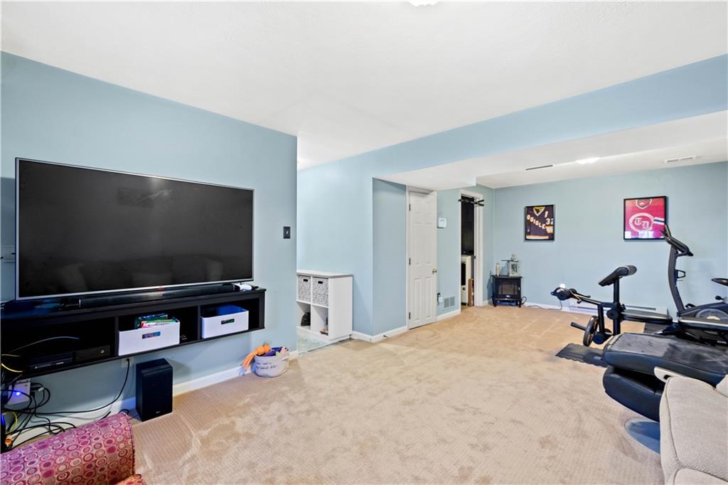 307 Lawrence Place Coraopolis, PA 15108 - Photo 23 of 25 a bedroom with furniture and a flat screen tv