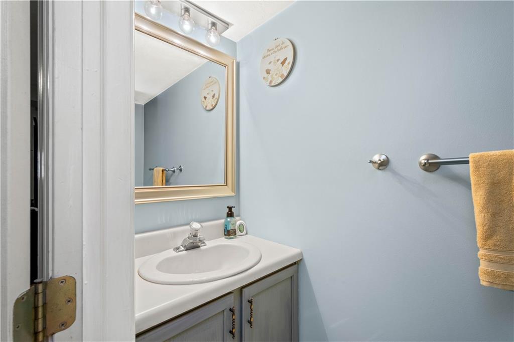 307 Lawrence Place Coraopolis, PA 15108 - Photo 24 of 25 a bathroom with a sink and a mirror