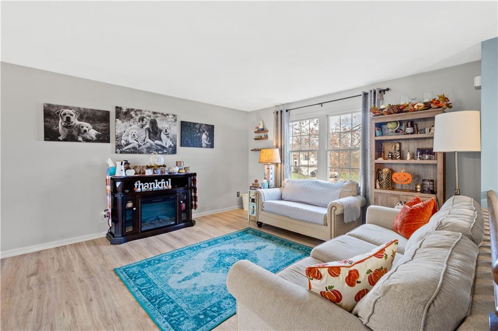 307 Lawrence Place Coraopolis, PA 15108 - Photo 8 of 25 a living room with furniture and a fireplace