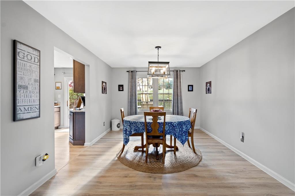 307 Lawrence Place Coraopolis, PA 15108 - Photo 10 of 25 a view of a dining room with furniture window and wooden floor