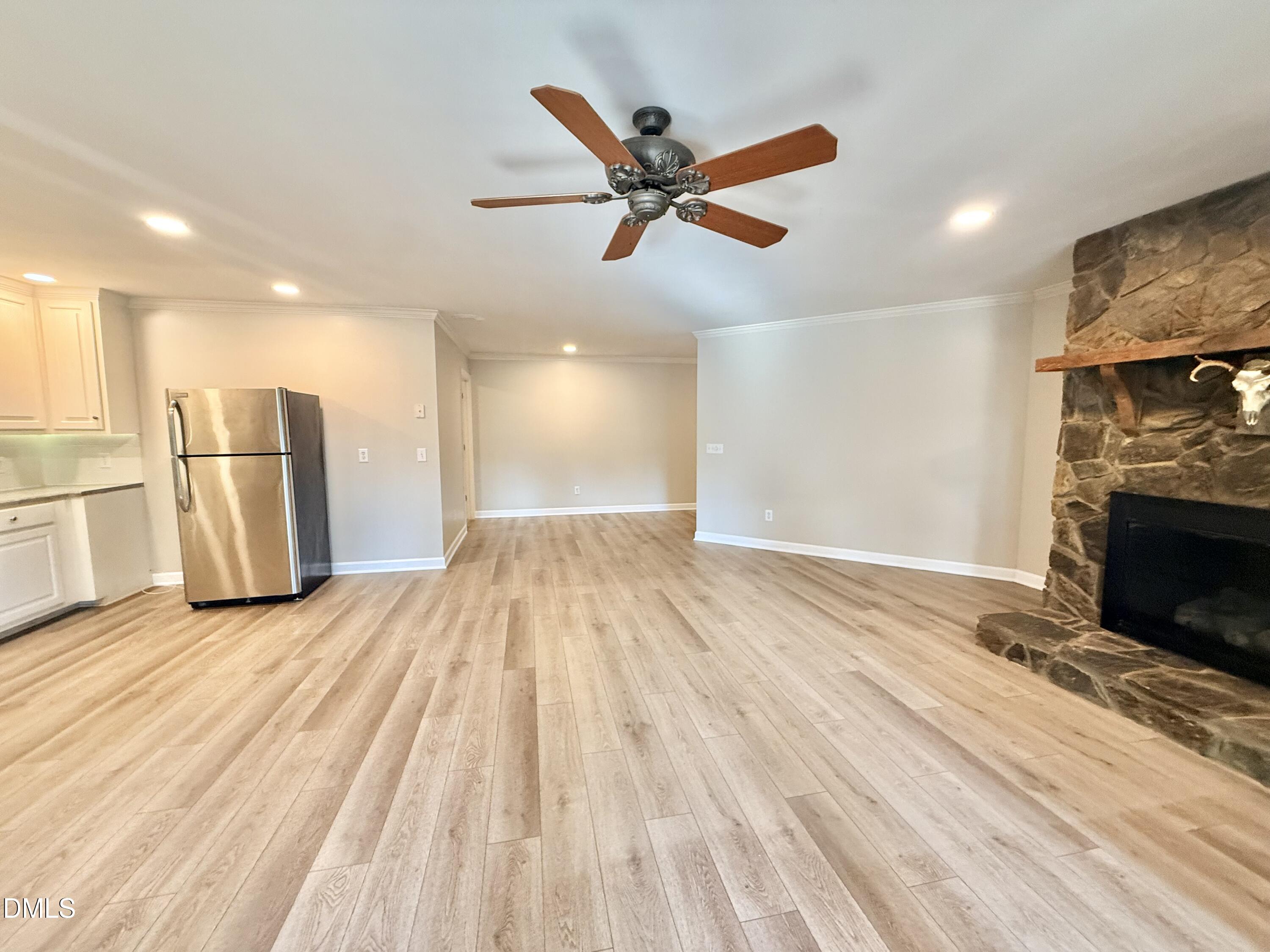 81 Beaver Crossing Road Roxboro, NC 27574 - Photo 46 of 80 a view of empty room with wooden floor and a fireplace
