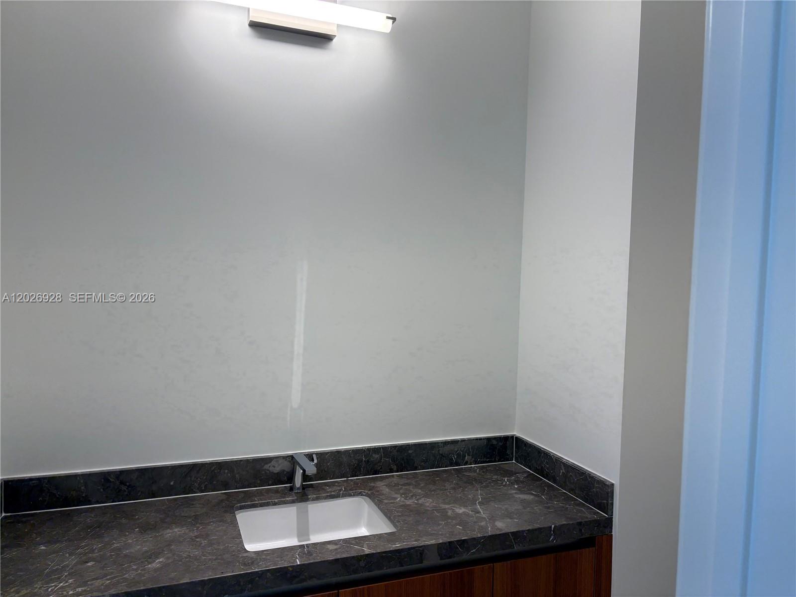 175 Southeast 25th Road, Unit 901 Miami, FL 33129 - Photo 15 of 18 a close up of a sink