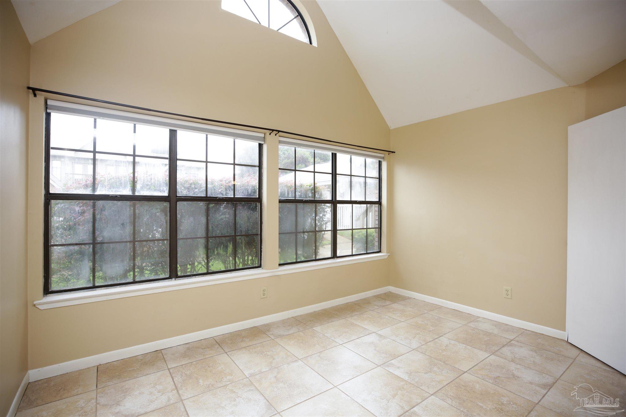 7150 Plantation Road, Unit 312 Pensacola, FL 32504 - Photo 12 of 23 Large windows to light the space