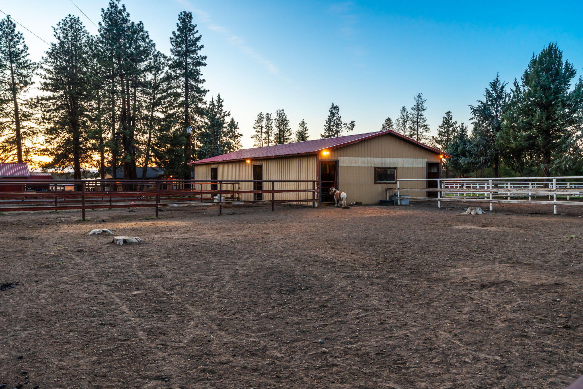 67500 Harrington Loop Road Bend, OR 97703 - Photo 32 of 72 a view of a house with a yard and sitting area