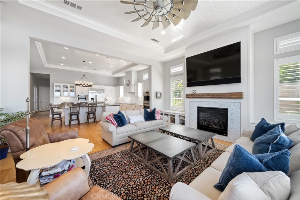 1594 Eucalyptus Road Nipomo, CA 93444 - Photo 11 of 75 a living room with furniture a flat screen tv and a fireplace