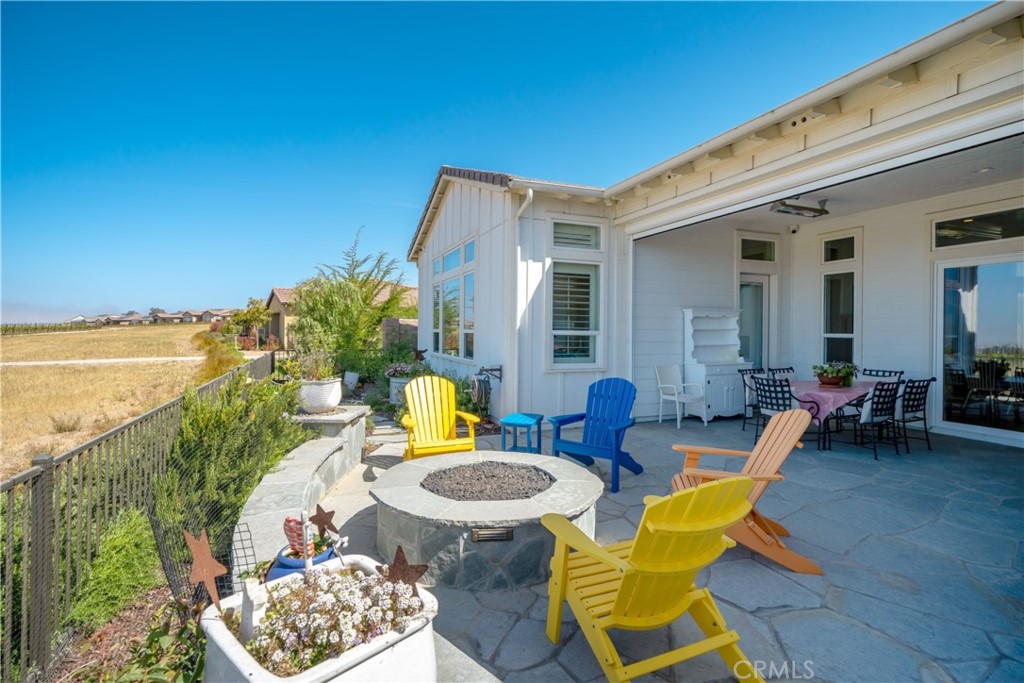 1594 Eucalyptus Road Nipomo, CA 93444 - Photo 26 of 75 a view of a patio with couches table and chairs near an ocean