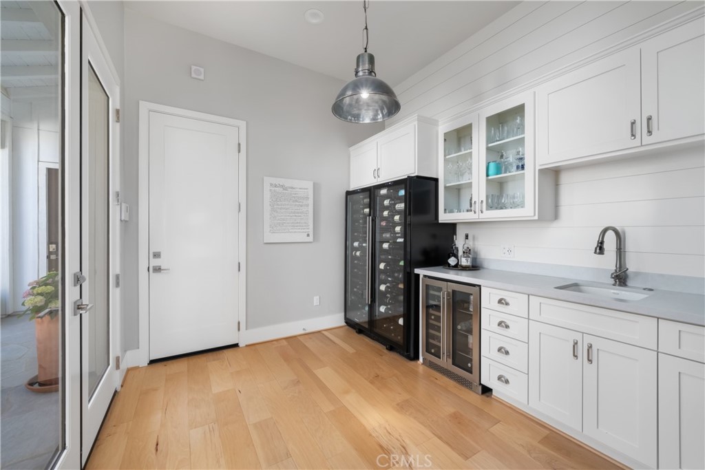 1594 Eucalyptus Road Nipomo, CA 93444 - Photo 30 of 75 a kitchen with a refrigerator and cabinets