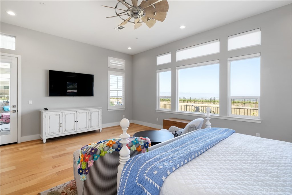 1594 Eucalyptus Road Nipomo, CA 93444 - Photo 37 of 75 a bedroom with furniture and a flat screen tv