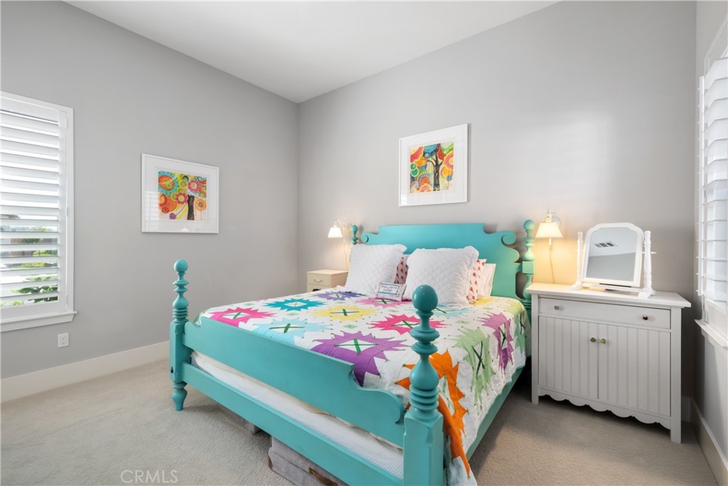 1594 Eucalyptus Road Nipomo, CA 93444 - Photo 49 of 75 a bedroom that has a bed and a table in it