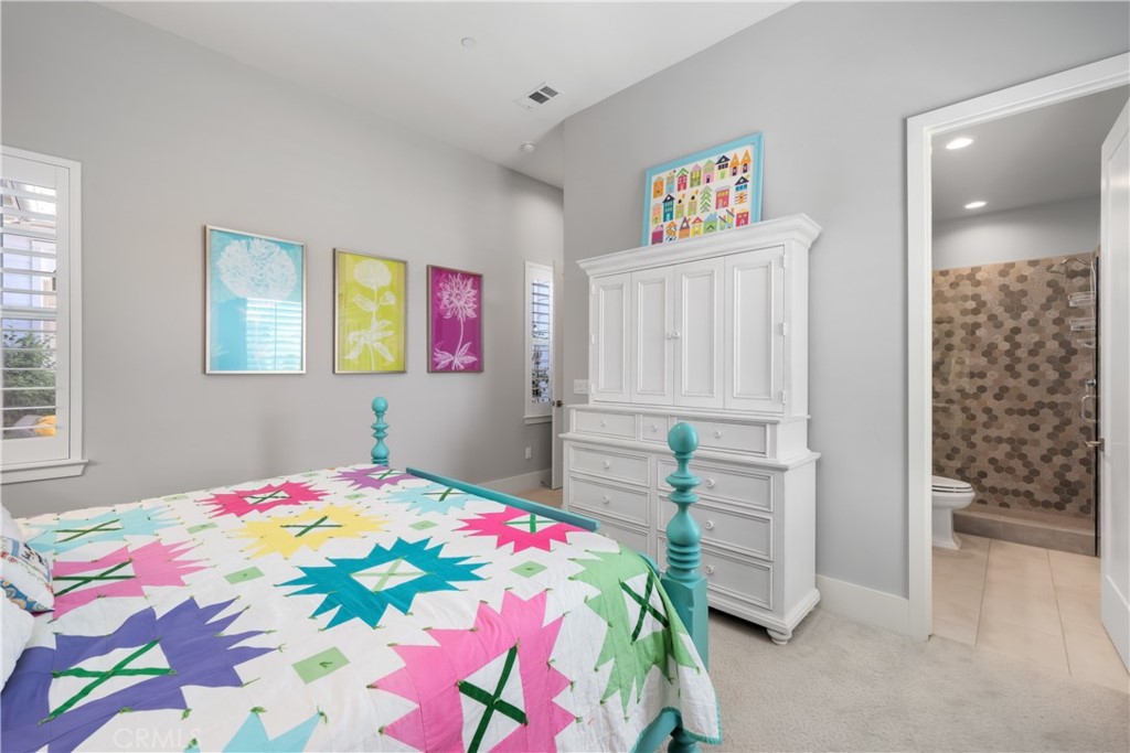 1594 Eucalyptus Road Nipomo, CA 93444 - Photo 50 of 75 a bedroom with a bed and a painting on the wall