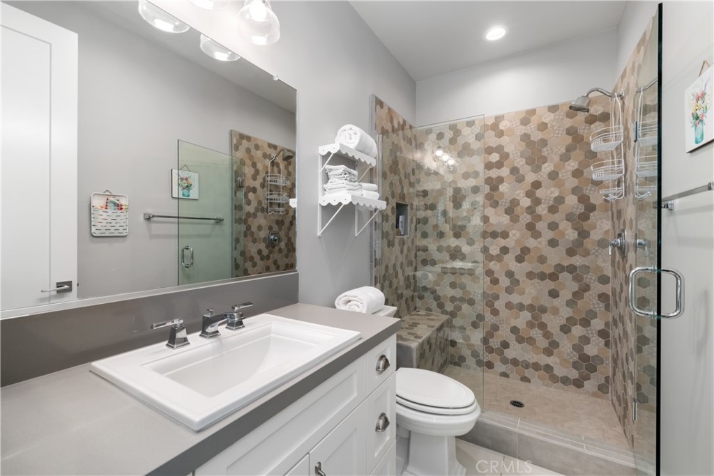 1594 Eucalyptus Road Nipomo, CA 93444 - Photo 51 of 75 a bathroom with a sink toilet and shower