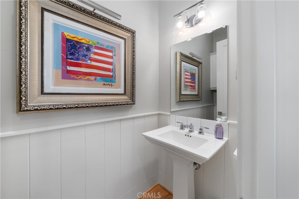 1594 Eucalyptus Road Nipomo, CA 93444 - Photo 52 of 75 a bathroom with a sink and a mirror
