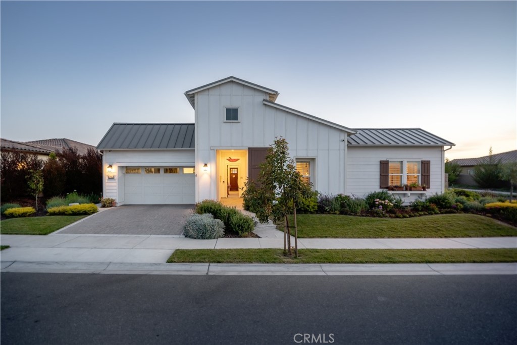 1594 Eucalyptus Road Nipomo, CA 93444 - Photo 61 of 75 a front view of a house with a yard and a garage