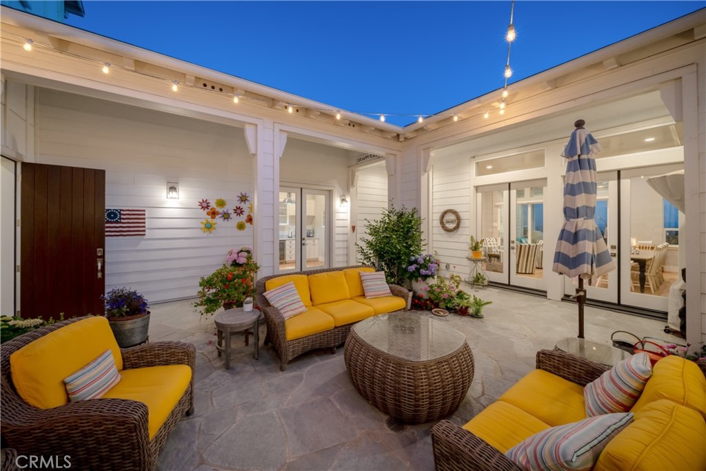 1594 Eucalyptus Road Nipomo, CA 93444 - Photo 67 of 75 a outdoor living space with furniture and a potted plant