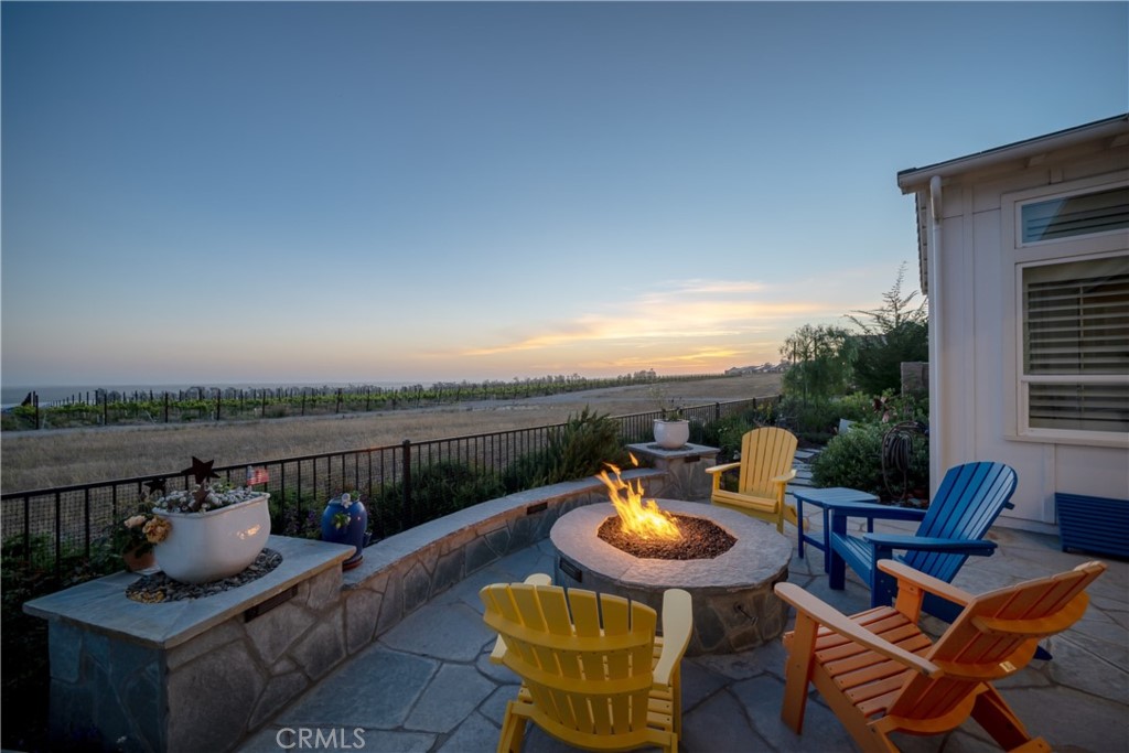1594 Eucalyptus Road Nipomo, CA 93444 - Photo 71 of 75 a view of a balcony with table and chairs couches with wooden floor and fence