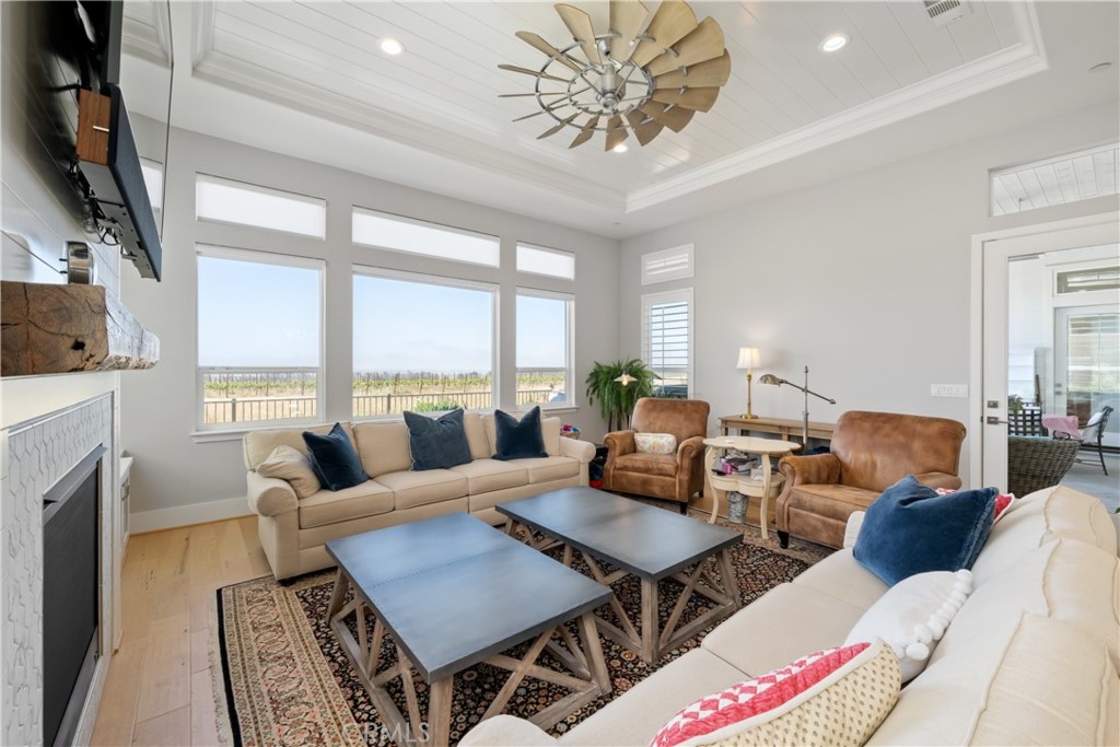 1594 Eucalyptus Road Nipomo, CA 93444 - Photo 10 of 75 a living room with furniture a large window and a fireplace