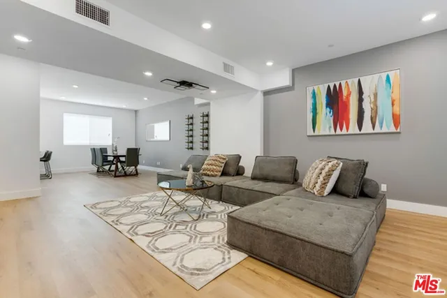 a living room with furniture or couch and a wooden floor