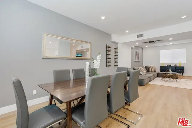 a living room with furniture a table and a fireplace