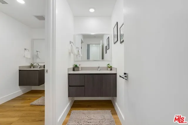 a bathroom with a sink and mirror