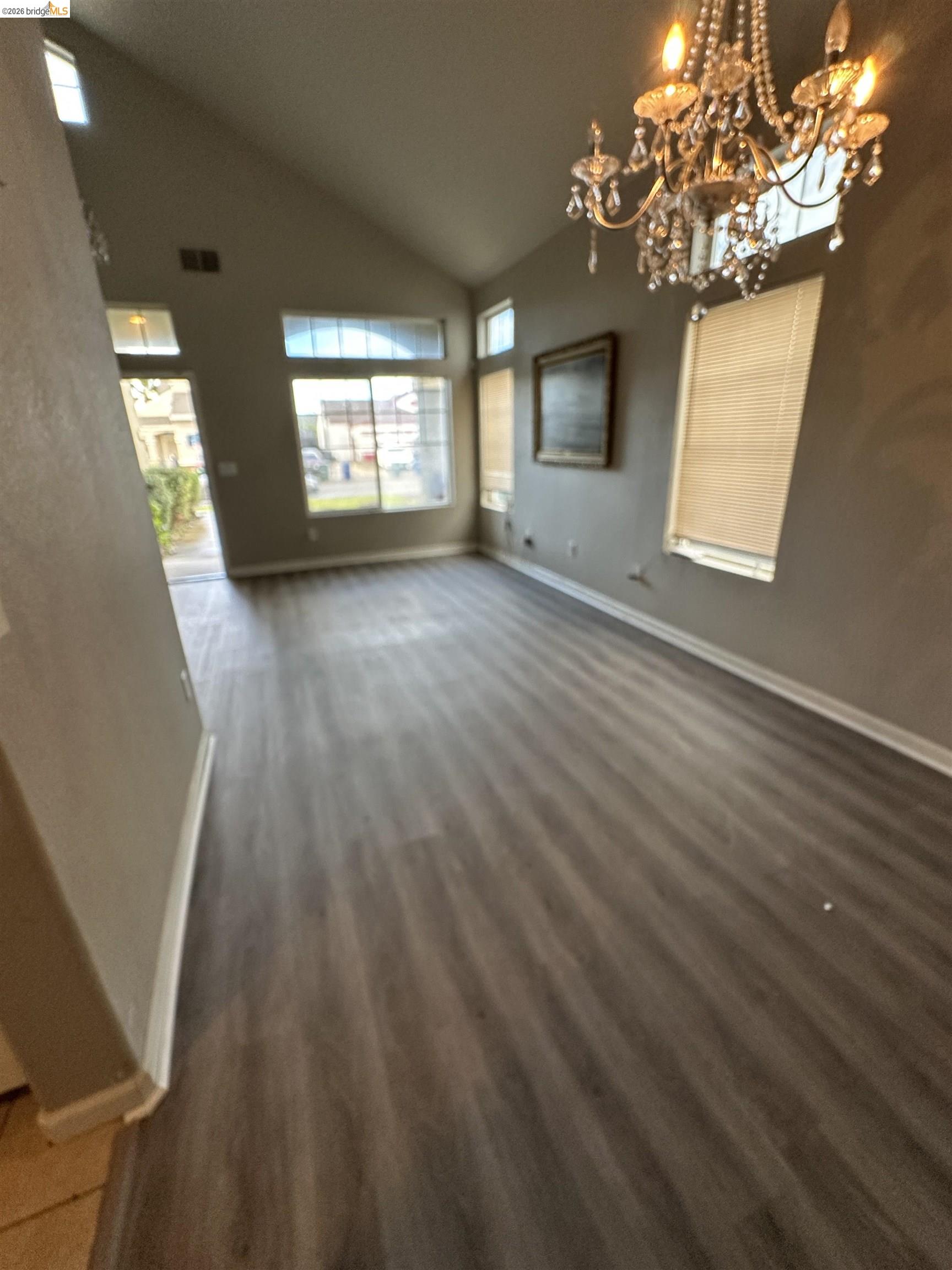 756 Rubier Way Rio Vista, CA 94571 - Photo 6 of 11 Unfurnished dining area featuring vaulted ceiling and a chandelier