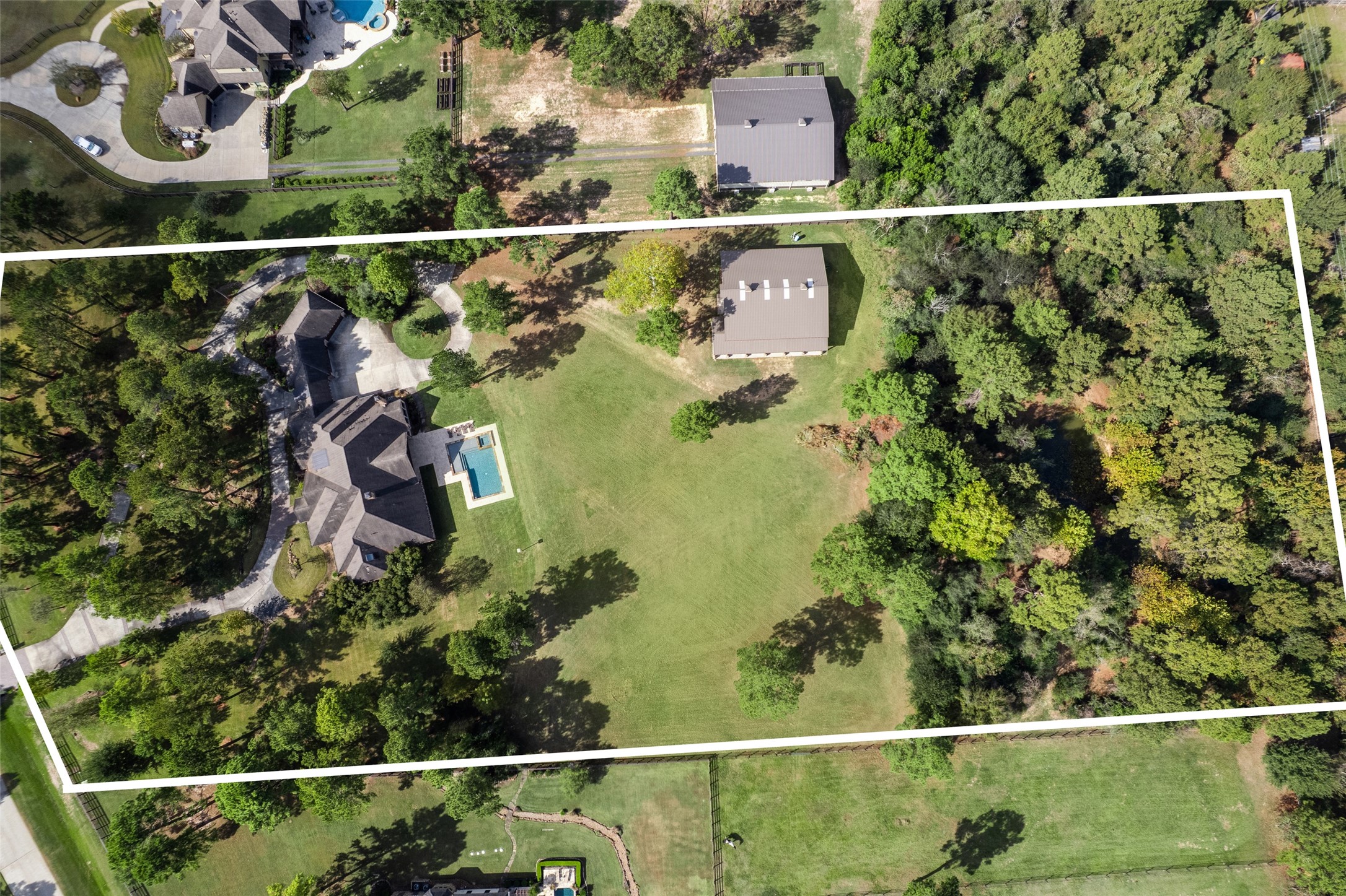 11 Willowcreek Ranch Road Tomball, TX 77377 - Photo 15 of 49 An aerial view of the property demonstrates the expanse and variety of terrain of the property. It is truly versatile!