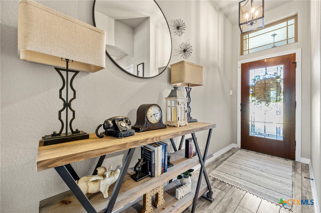 166 Mountain Rose Road Belton, TX 76513 - Photo 6 of 37 a view of a room with wooden floor and windows