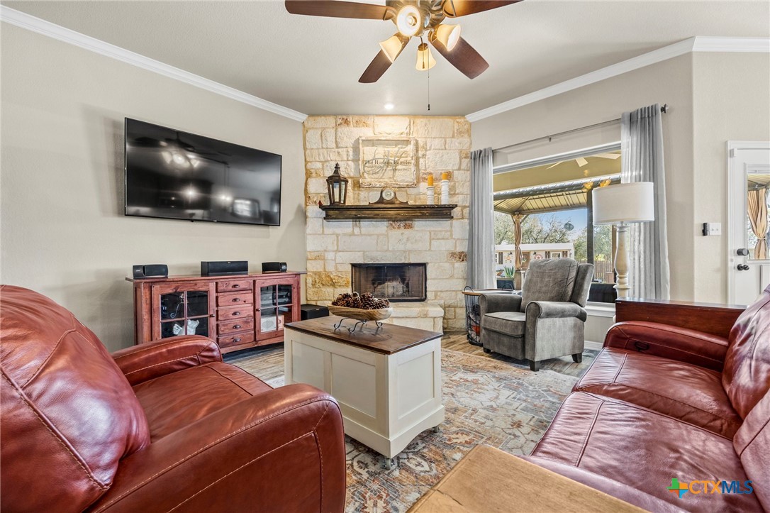 166 Mountain Rose Road Belton, TX 76513 - Photo 7 of 37 a living room with furniture and a flat screen tv