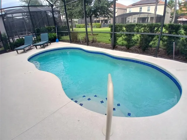 a bedroom with a bed and a mirror