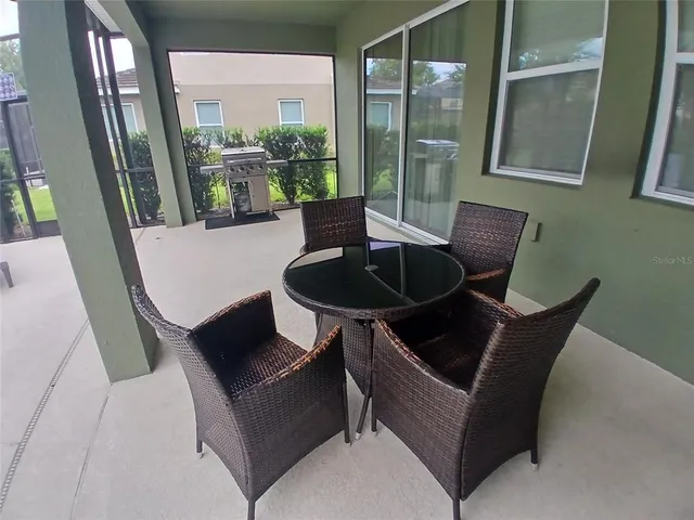 a bedroom with two beds and wooden floor