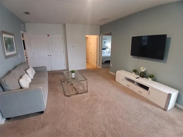 a swimming pool with outdoor seating outdoor seating and lake view