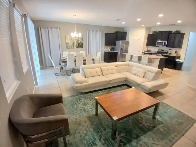 a bathroom with a granite countertop sink toilet and mirror