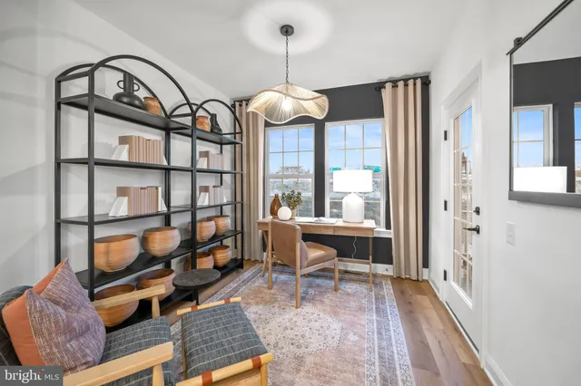 a view of a livingroom with furniture and a window