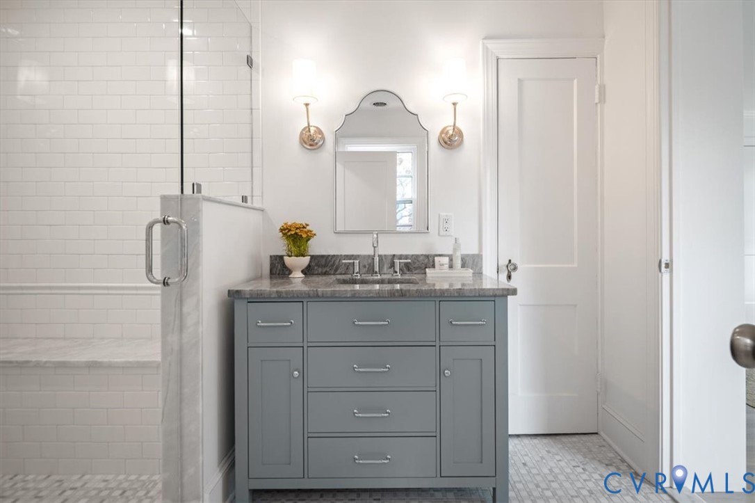 4703 Sylvan Road Richmond, VA 23225 - Photo 24 of 49 Primary bathroom with double sinks, walk in shower