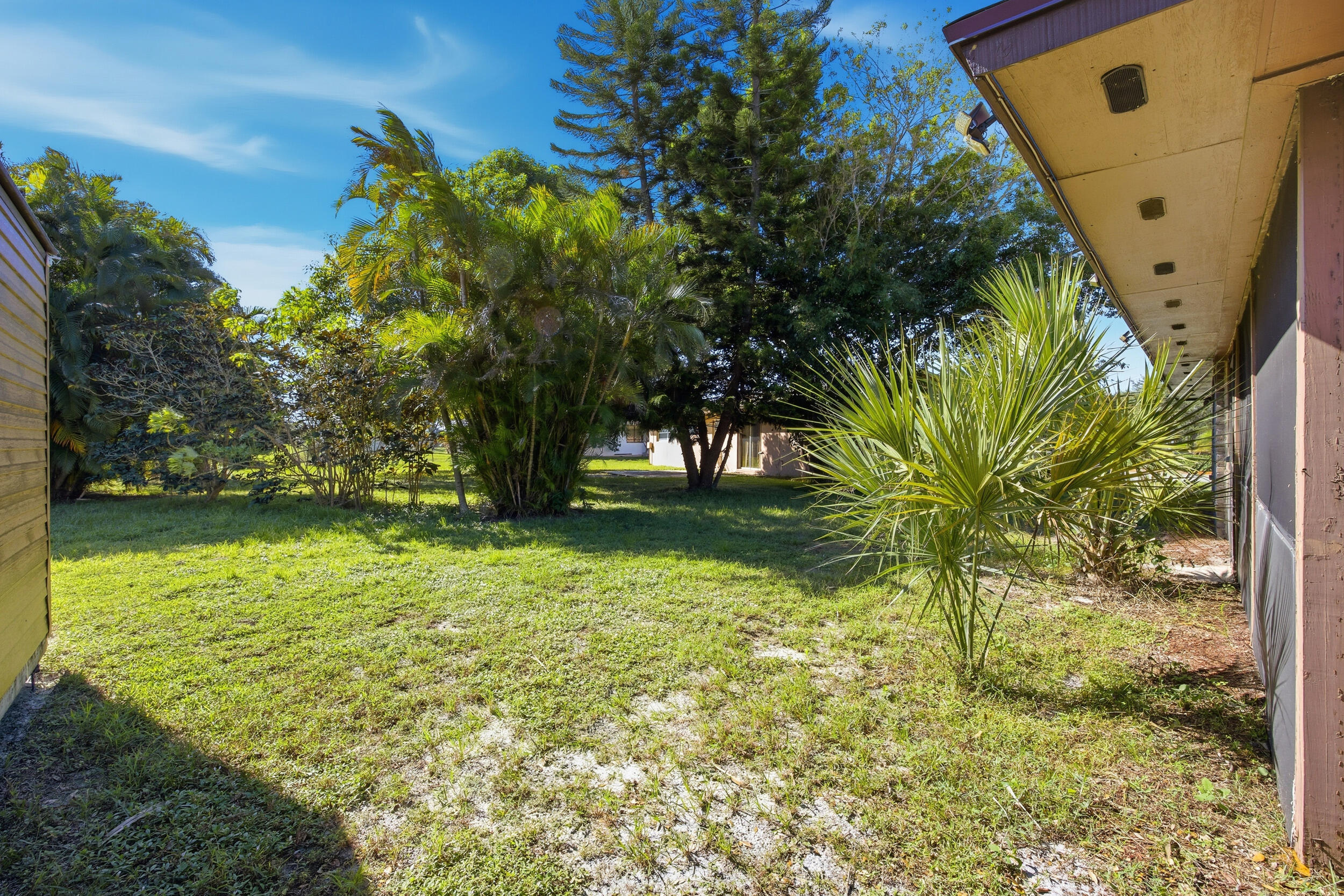 1102 Southeast Petunia Avenue Port St. Lucie, FL 34952 - Photo 12 of 23 a view of a garden
