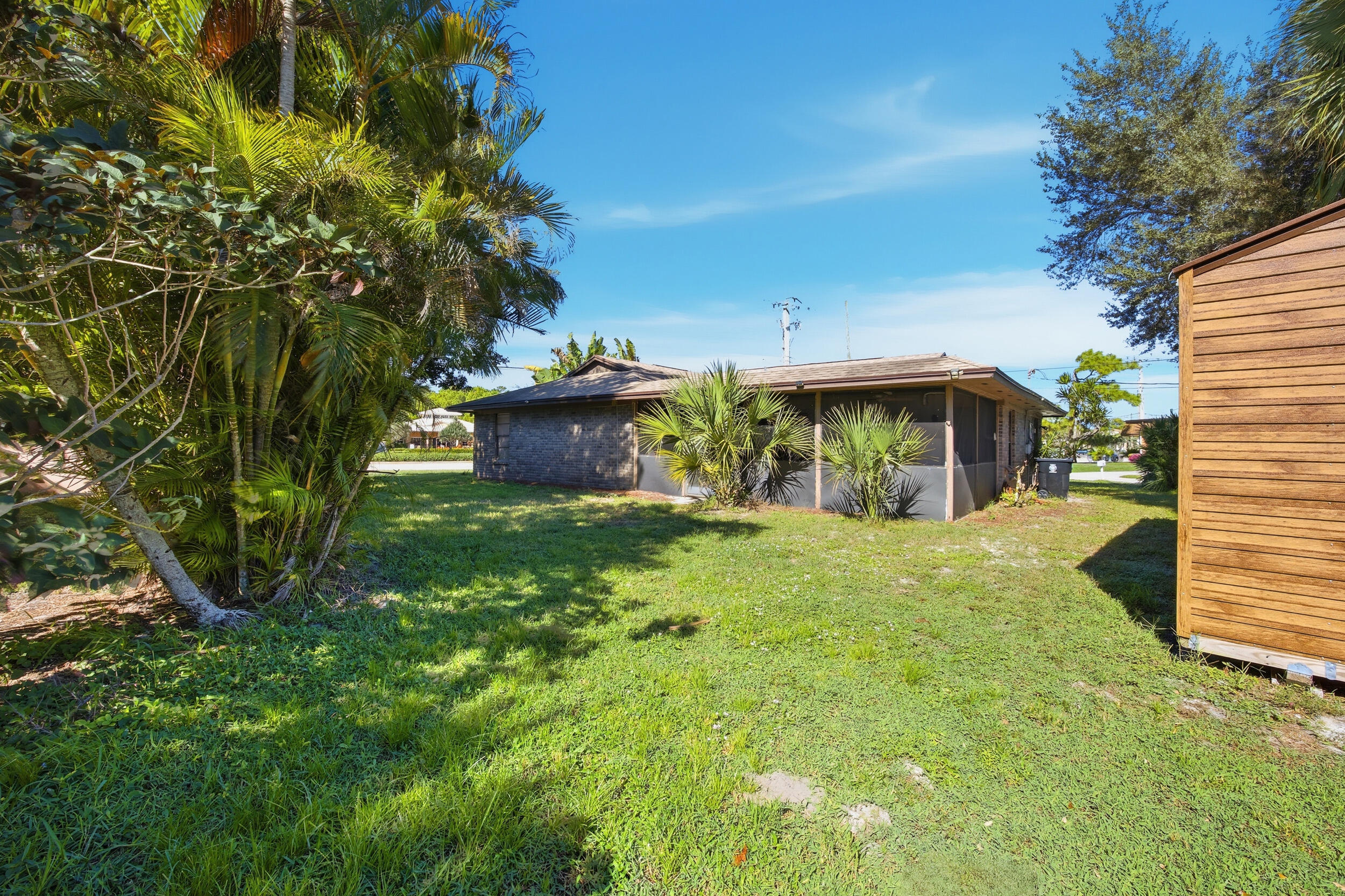 1102 Southeast Petunia Avenue Port St. Lucie, FL 34952 - Photo 13 of 23 a view of a house with a yard and tree s
