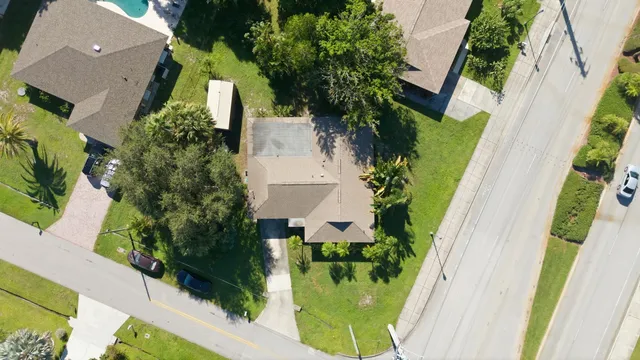 an aerial view of a house with a garden