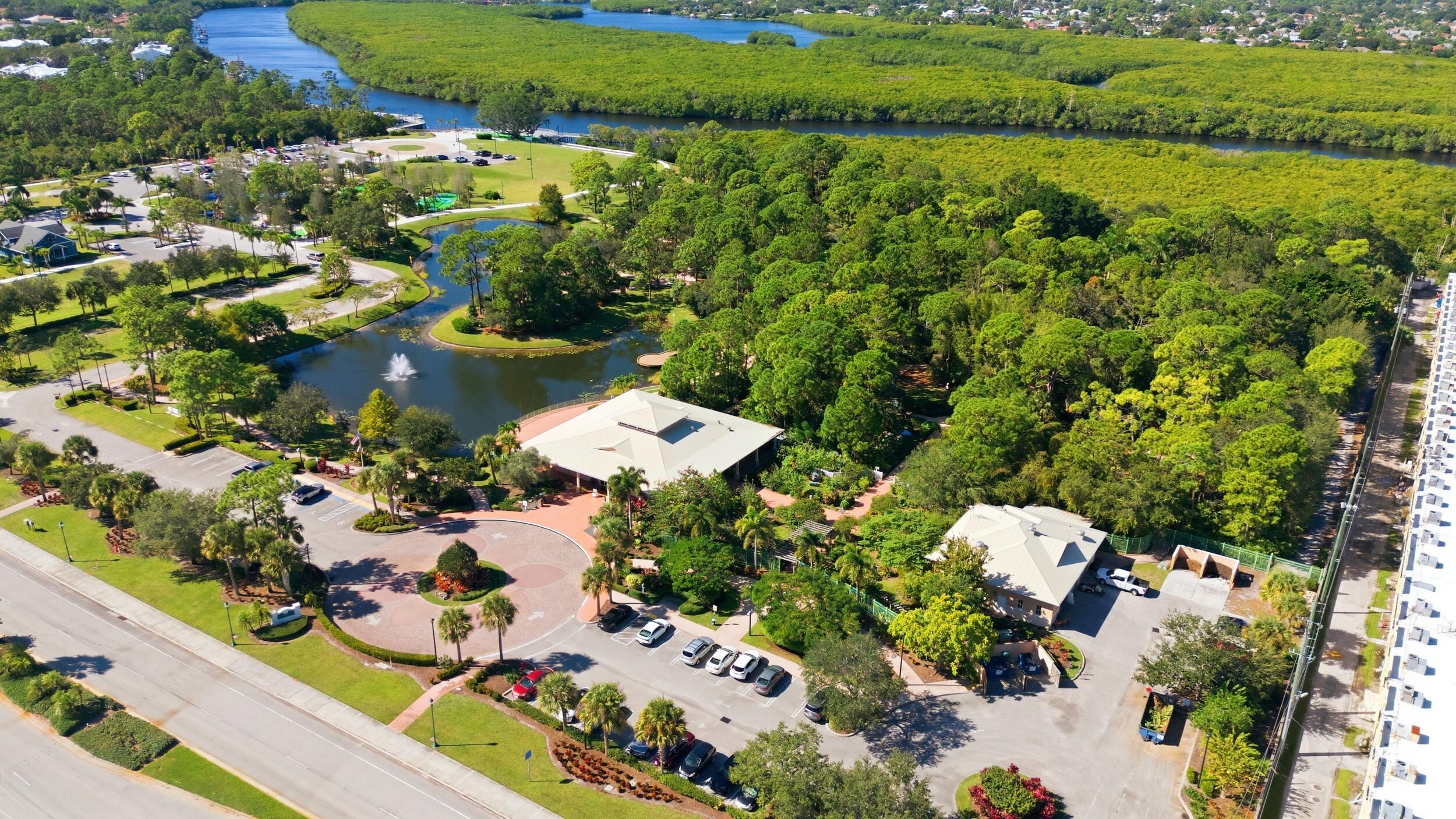1102 Southeast Petunia Avenue Port St. Lucie, FL 34952 - Photo 18 of 23 an aerial view of residential houses with outdoor space