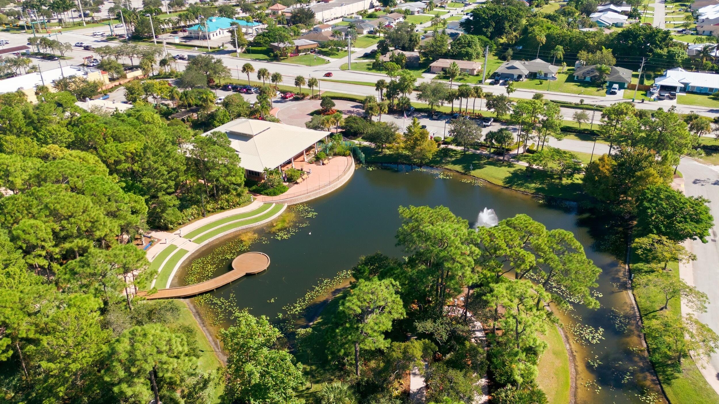 1102 Southeast Petunia Avenue Port St. Lucie, FL 34952 - Photo 21 of 23 an aerial view of residential house with outdoor space and swimming pool