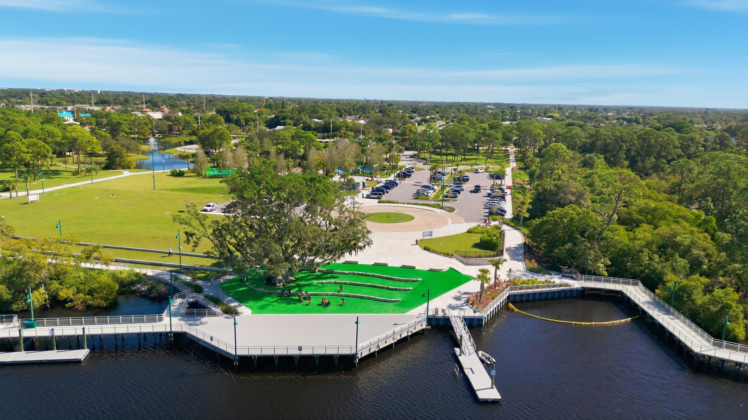 1102 Southeast Petunia Avenue Port St. Lucie, FL 34952 - Photo 23 of 23 a view of a swimming pool with a patio