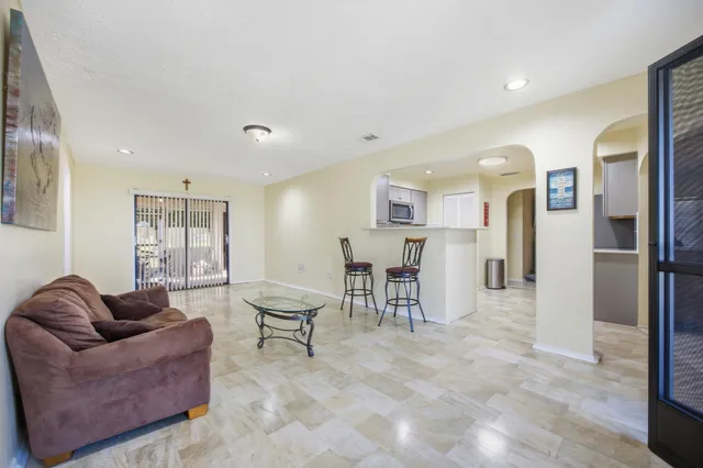 a living room with furniture and a window