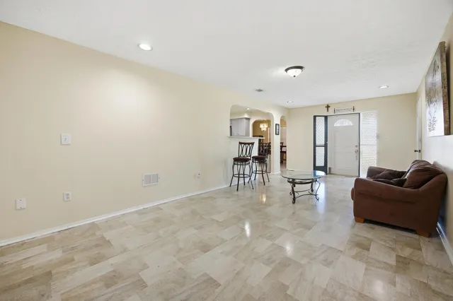 a living room with furniture and a table