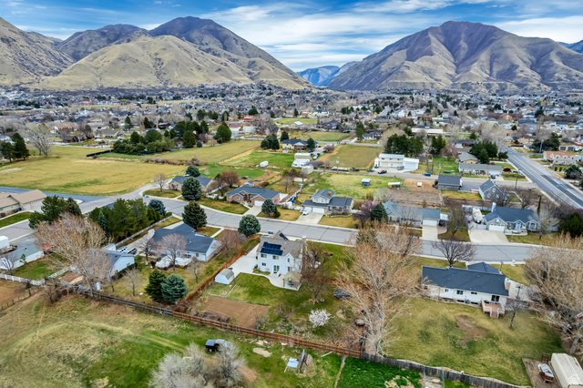 1697 North 500 West Mapleton, UT 84664 - Photo 39 of 50 Aerial view of property and surrounding area with nearby suburban area and mountains