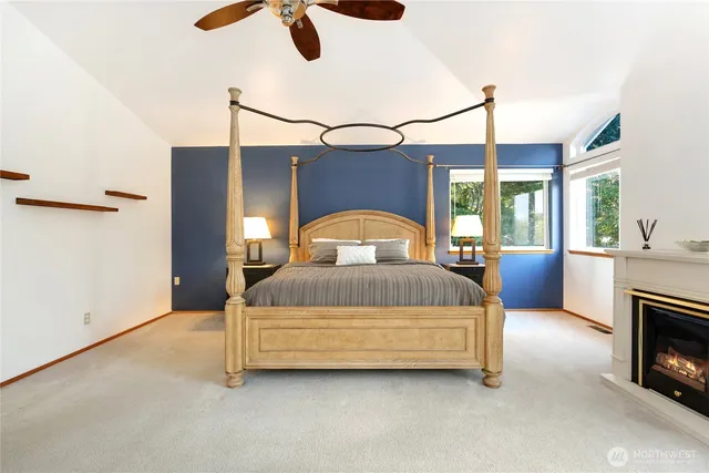 a spacious bathroom with a tub sink and mirror
