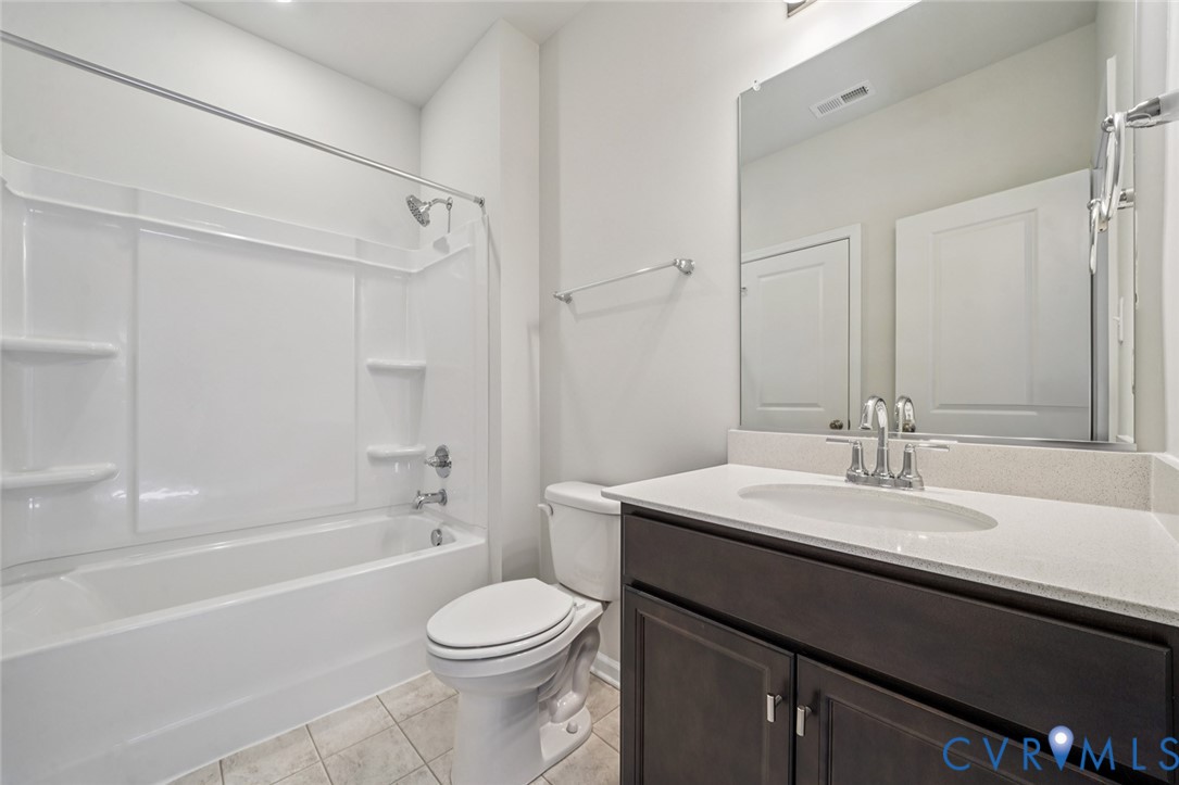 342 Mt Mccauley Way Aylett, VA 23009 - Photo 19 of 31 a bathroom with a sink a toilet and shower